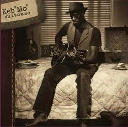 KEB' MO' :  SUITCASE  (PURE PLEASURE)

In Suitcase Keb' Mo', al secolo Kevin Moore, si riunisce con John Porter, il produttore dei suoi primi successi, e il risultato  una piacevole suite midtempo di canzoni dedicate al bagaglio emotivo che ognuno custodisce in s nell'arco di una vita trascorsa a ricercare la pace, l'amore e una certa dose di redenzione personale. Moore affronta questi delicati temi con stupefacente leggerezza, cos da rendere Suitcase un'ironica riflessione sulla vita moderna, un disco brillante e positivo a cominciare dall'effervescente ritmo reggae della traccia di apertura, Your Love, uno dei migliori brani dell'album. Altri punti salienti di Suitcase sono la deliziosa ballata Still There for Me, I'm a Hero, una celebrazione dell'uomo e delle sue vittorie private e il brano rilassante e pieno di speranza che chiude il disco, Life Is Beautiful. Keb' Mo'  generalmente classificato come un musicista blues, ma la verit  che, a parte il suo primo album, ha realizzato pochissimo materiale veramente blues: probabilmente  molto pi vicino nel tono, nei temi e nelle atmosfere a James Taylor che a Robert Johnson o a qualsiasi altra figura del blues. In Suitcase, per, si rivolge al blues come dimostra la title track, una canzone coinvolgente su ci che le persone portano in una relazione sentimentale e su ci che si portano via alla fine della stessa. In questo disco Keb' Mo' d il meglio di s: sfrutta la sua capacit di sintetizzare forme roots e blues creando melodie contemporanee che parlano di lotte, di dolore e della fede cieca nella redenzione personale che accompagna le persone ogni giorno mentre si fanno strada nel complesso mondo del XXI secolo.